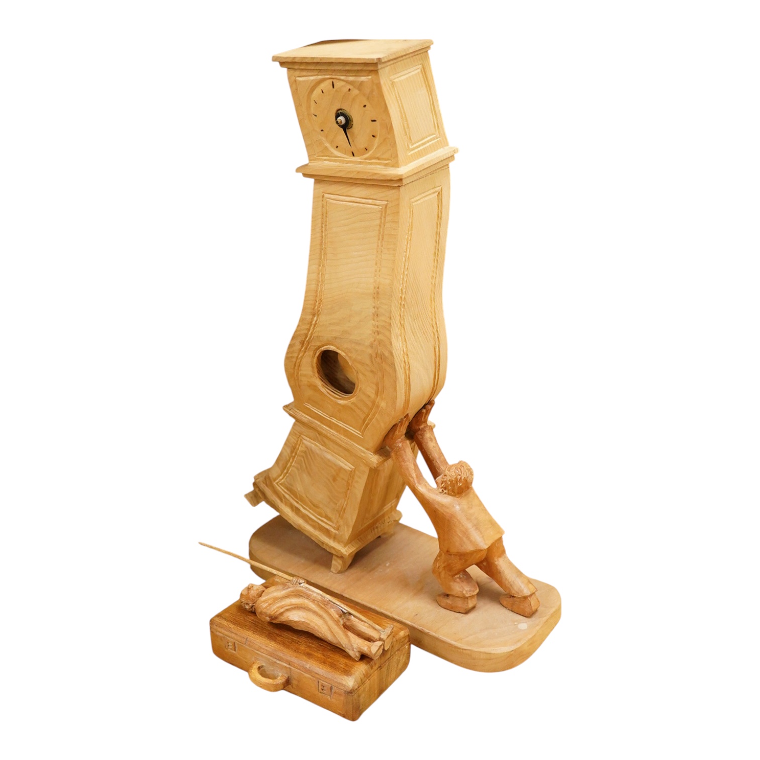 Pierre Decorse (b.1953), a naturalistically modelled wooden sculpture of a grandfather clock and a figure, together with two other sculptures comprising a suitcase and figure, largest 42cm high